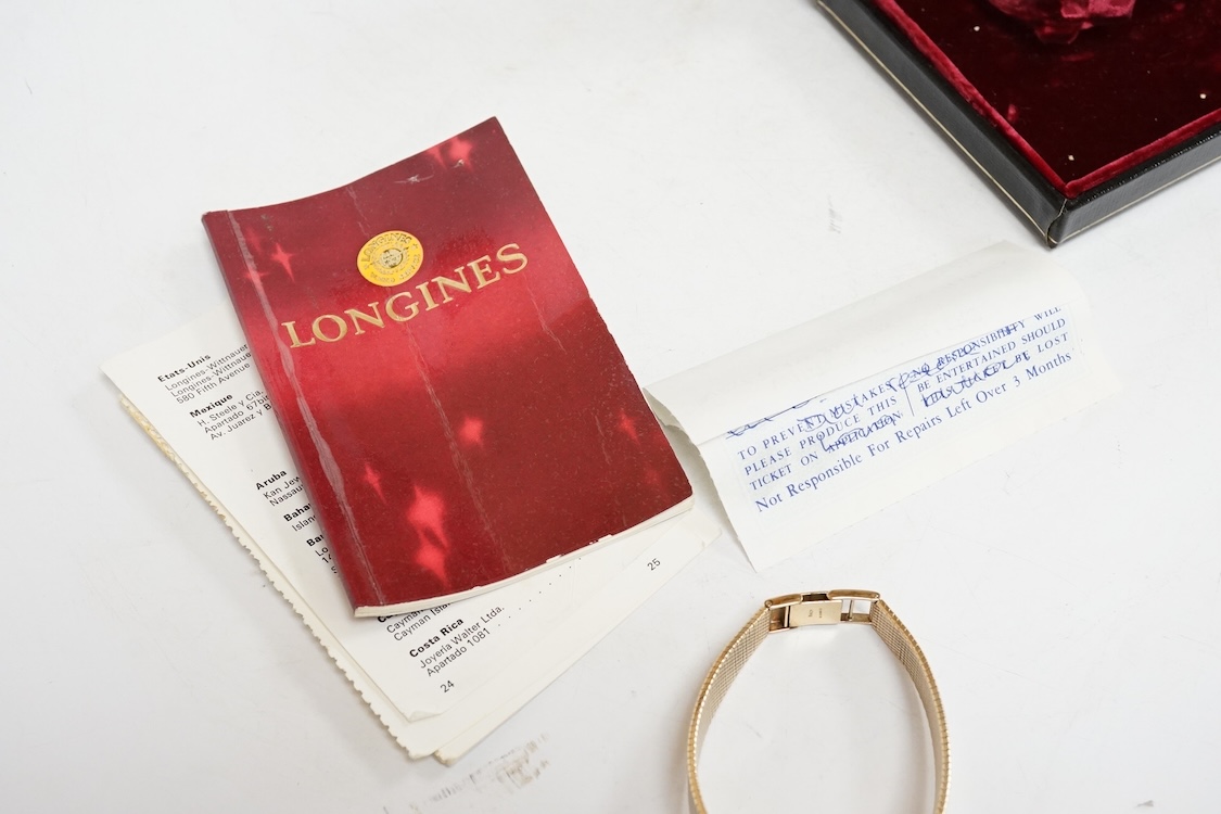 A lady's early 1970's 9ct gold Longines manual wind wrist watch, on an associated 9ct gold bracelet, gross weight 38 grams, with Longines box and pamphlet.
